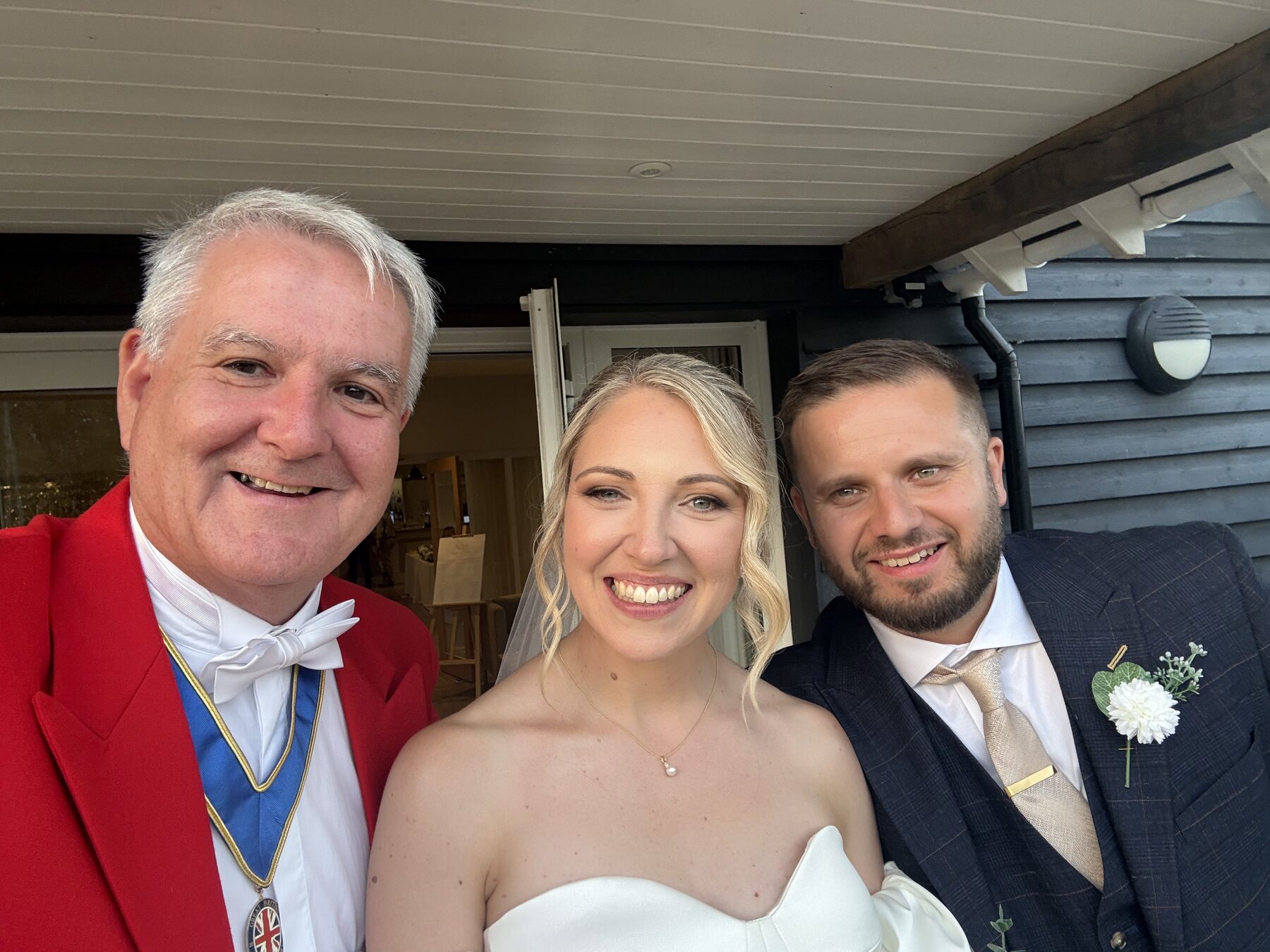 Andrew Morgan with a bride and groom, wedding venue grounds