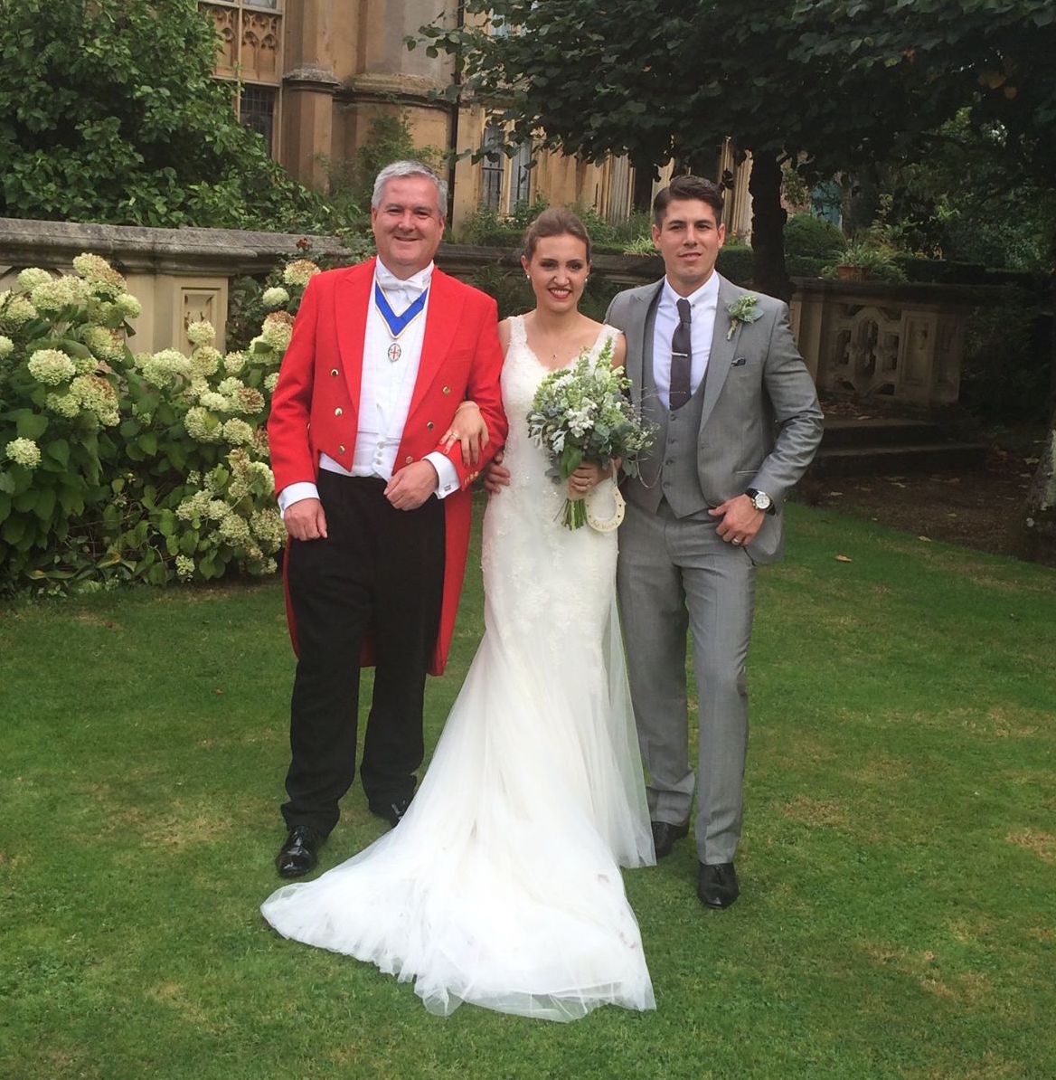 Andrew Morgan with a bride and groom in the grounds of their wedding venue